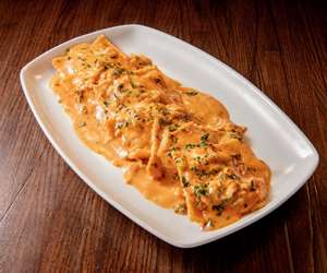 Lobster Ravioli served in a pink brandy sauce.