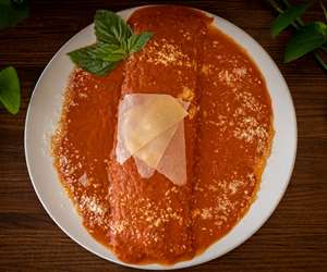 Ricotta & Spinach Manicotto. Large tube pasta stuffed with spinach, ricotta and mozzarella. 