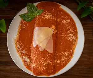 Ricotta & Spinach Manicotto. Large tube pasta stuffed with spinach, ricotta and mozzarella. 