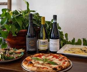 Fresh salad, margarita pizza and a pasta dish from Pizza Gorda. 